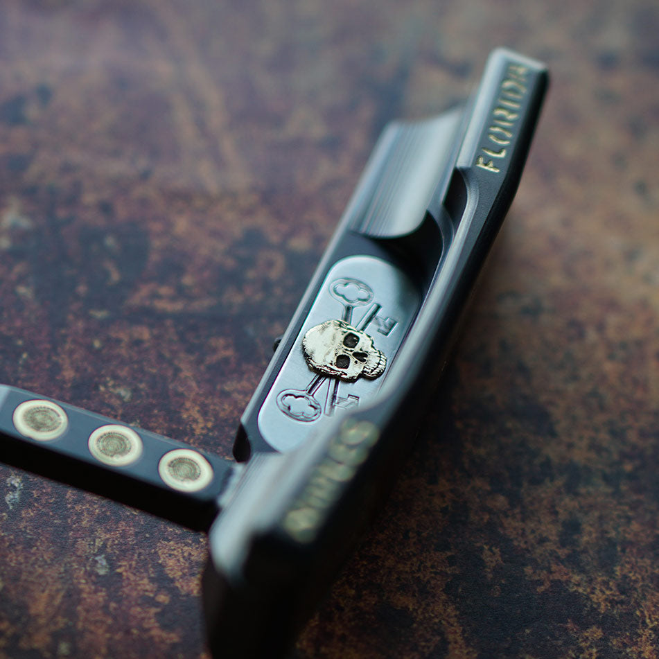 skull putter with ornate details